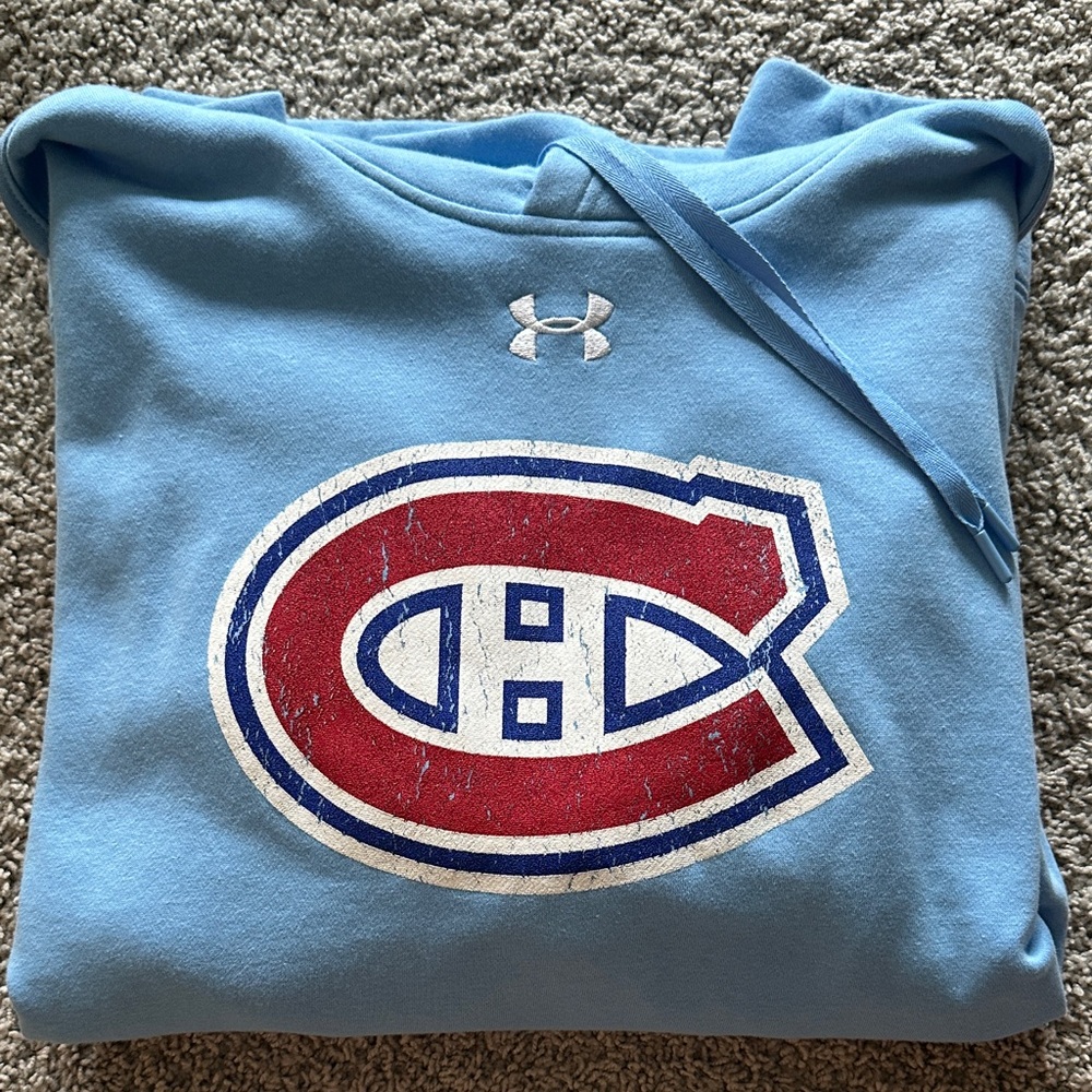Under Armour Light Blue Sweatshirt with Montreal Canadians logo.